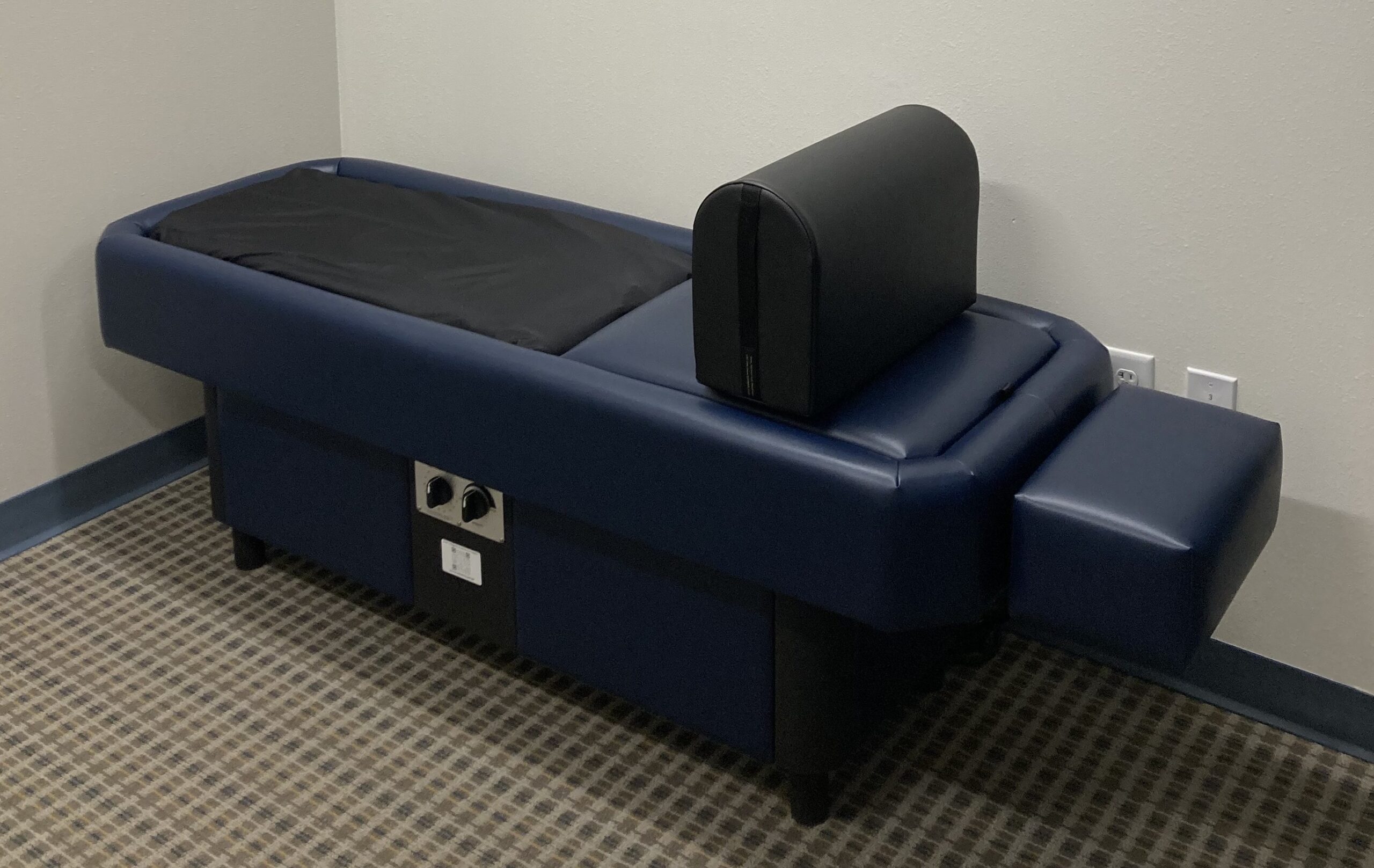 photo of a heated, dry, hydromassage table